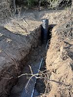 A view of a wet well installed on private land