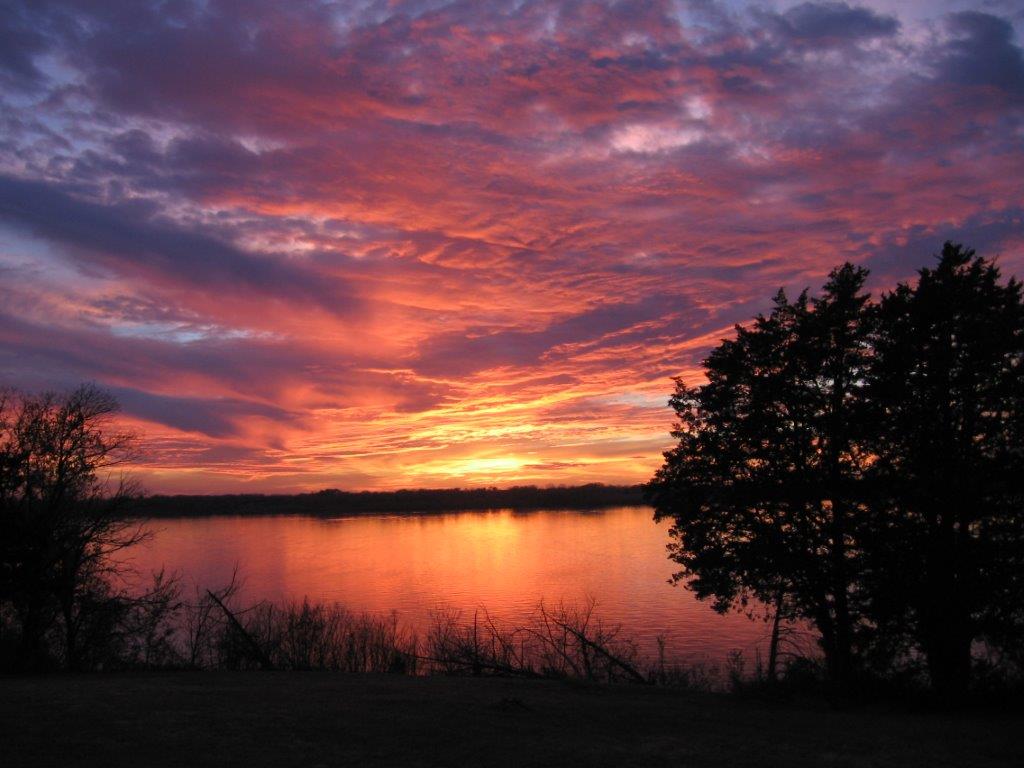 sunset behind a kansas lake