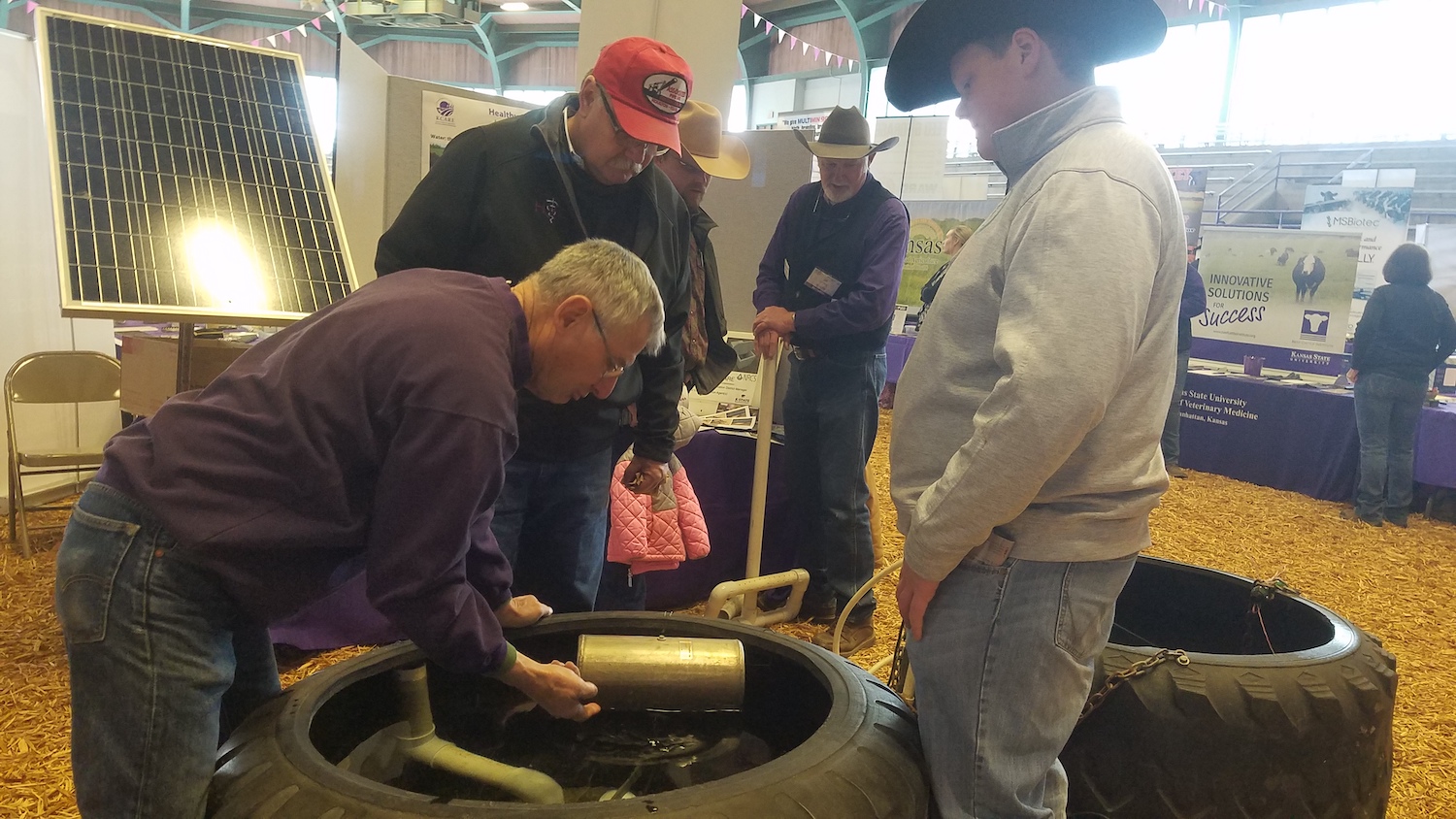 watershed specialists demonstrate how to set up a tire tank
