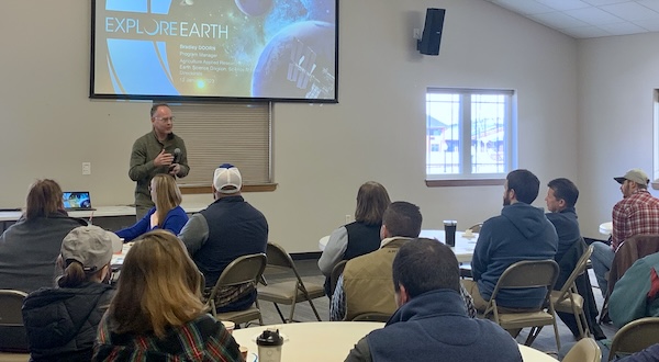 a speaker presents to a seated group
